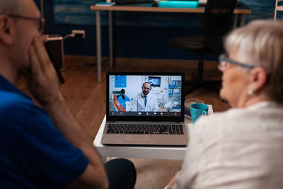 People sitting on table at home