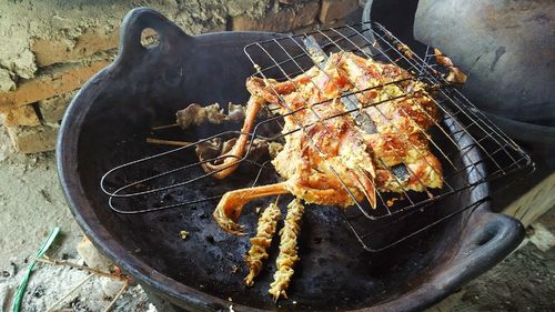 High angle view of meat on barbecue grill