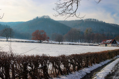 Scenic view of snow covered mountains against sky