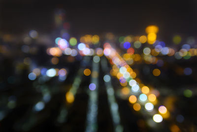 Defocused image of illuminated lights at night