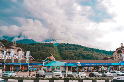 Panoramic view of buildings and mountains against sky