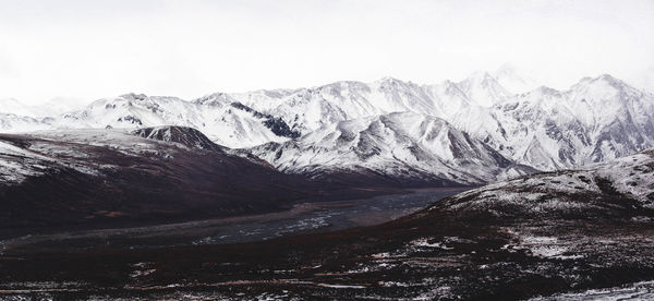 Scenic view of snowcapped mountains against sky