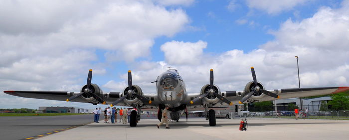 View of airplane against cloudy sky