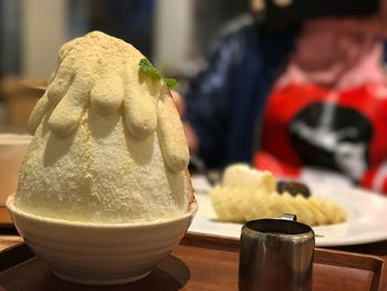 Close-up of ice cream in bowl on table