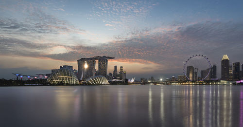 View of marina bay sands at waterfront during sunset