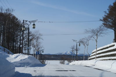 Snow covered landscape against sky