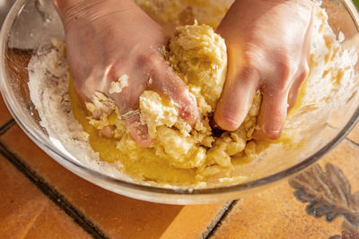 Close-up of person preparing food in bowl