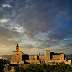 Historic building against sky during sunset