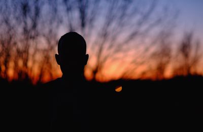 Silhouette of person against sky during sunset