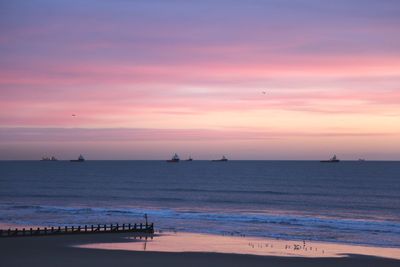 Scenic view of sea against sky during sunset