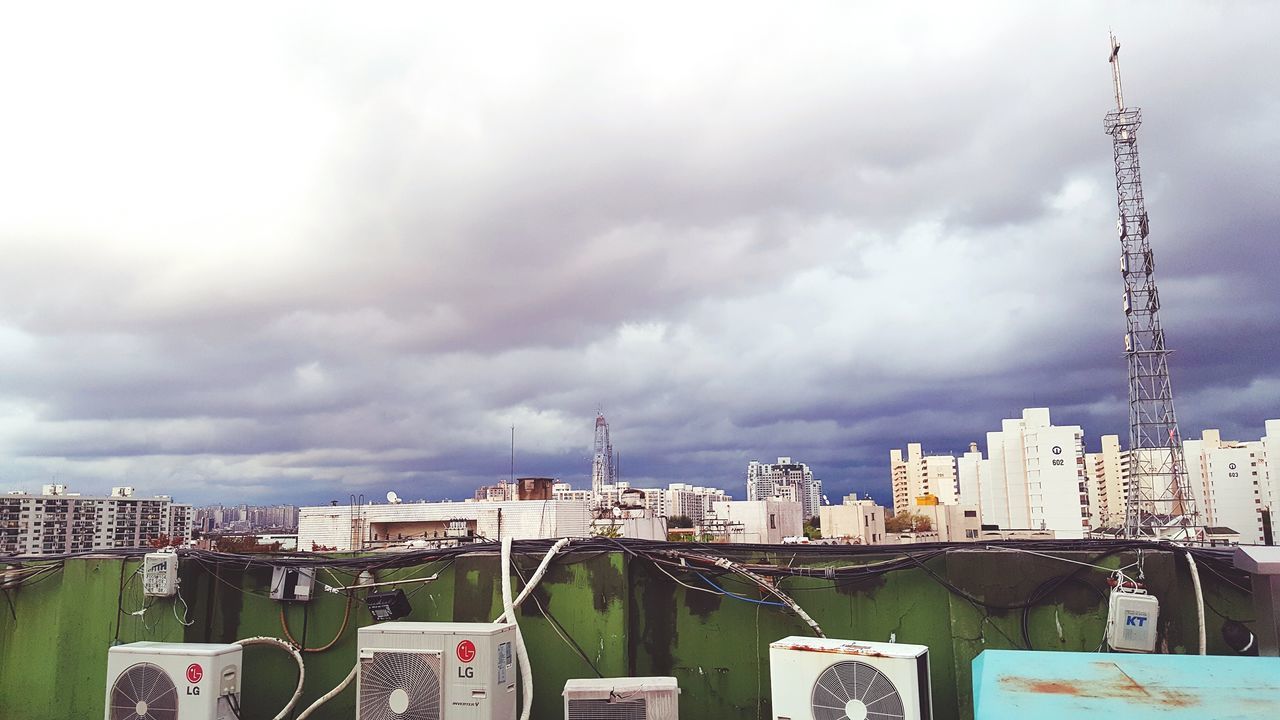 building exterior, architecture, built structure, sky, cloud - sky, cloudy, city, weather, residential building, residential structure, overcast, cloud, residential district, industry, construction site, house, factory, day, low angle view, building