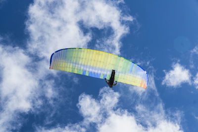 Low angle view of kite flying against sky