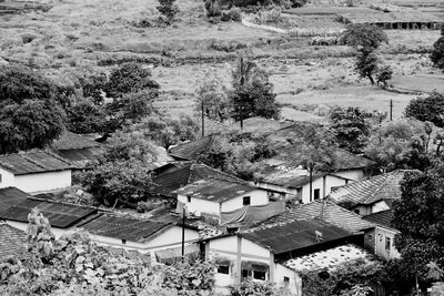 High angle view of houses and trees in town