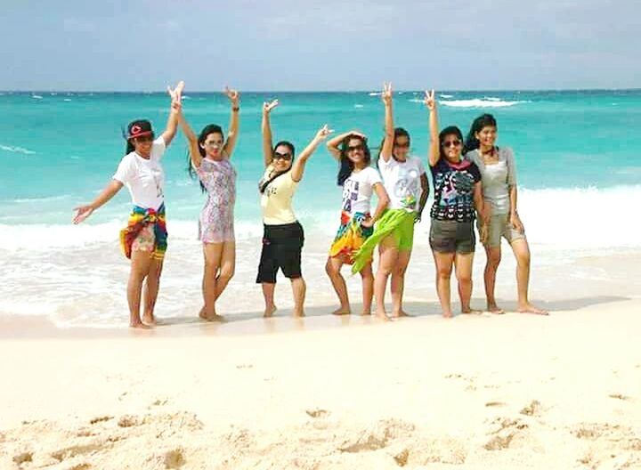 PEOPLE STANDING ON BEACH