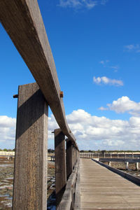 Wooden bridge against blue sky
