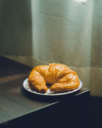 Close-up of bread in plate on table