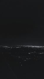 Aerial view of sea against sky at night