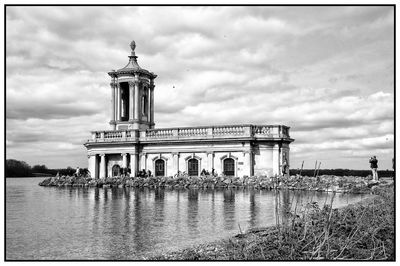 Low angle view of building against cloudy sky