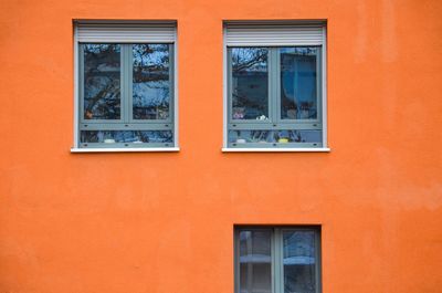 Low angle view of window on wall of building