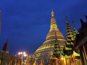 Low angle view of pagoda against sky at dusk