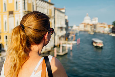 Woman standing in front of water