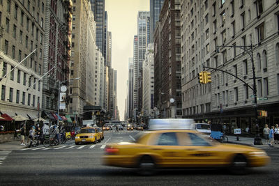 Cars moving on road in city