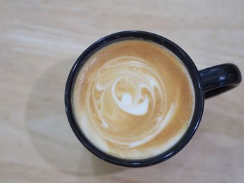 High angle view of cappuccino on table
