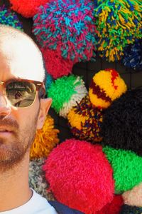 Close-up portrait of young man wearing sunglasses