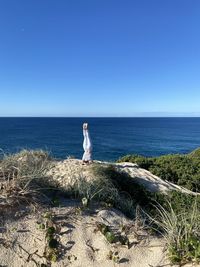 Scenic view of sea against blue sky