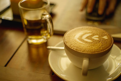 Close-up of coffee cup on table