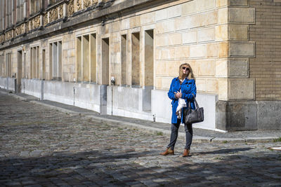 Full length of woman walking in city