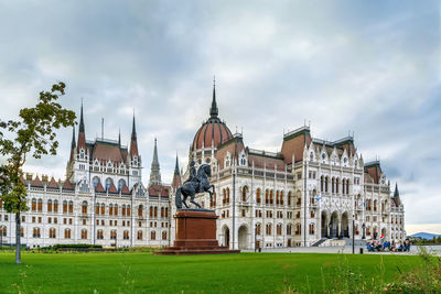 Hungarian parliament building was designed in neo-gothic style and opened in 1902, budapest, hungary
