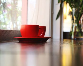 Close-up of coffee cup on table