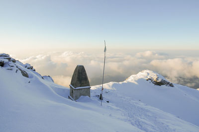 Scenic view of snow covered mountains against sky