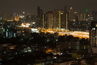 High angle view of illuminated city buildings at night