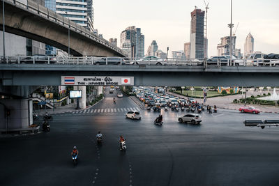 Thai-japanese friendship bridge at silom intersection area with heavy traffic at rush hour 