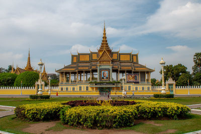 View of temple building against cloudy sky