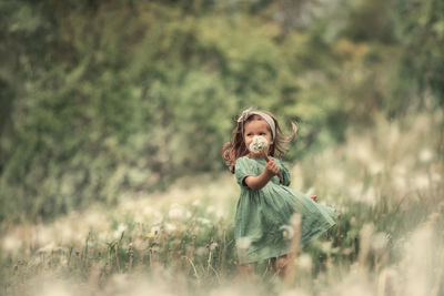 Full length of girl on field