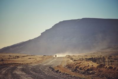 Scenic view of desert against clear sky