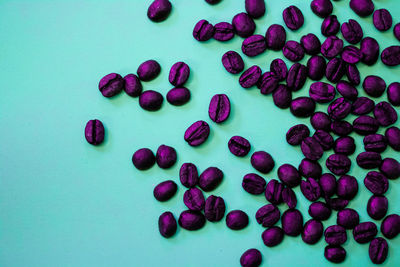 High angle view of purple berries on table