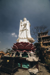 Low angle view of statue against sky