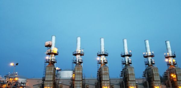 Low angle view of smoke stack against sky