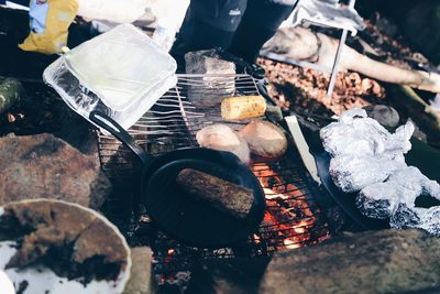 High angle view of meat on barbecue grill