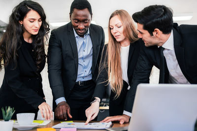 Business people discussing on table