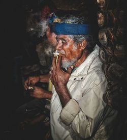 Portrait of senior man sitting outdoors