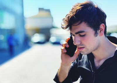 Close-up portrait of young man looking at camera