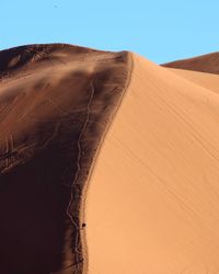 Scenic view of desert against clear sky