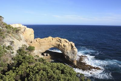 Scenic view of sea against blue sky