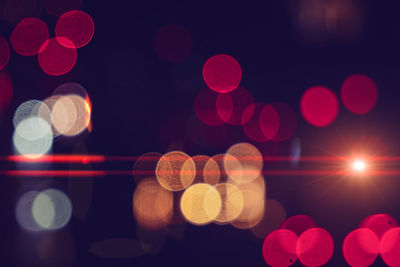 Defocused image of illuminated lights at night