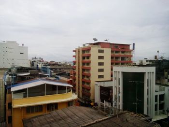 Buildings in city against sky